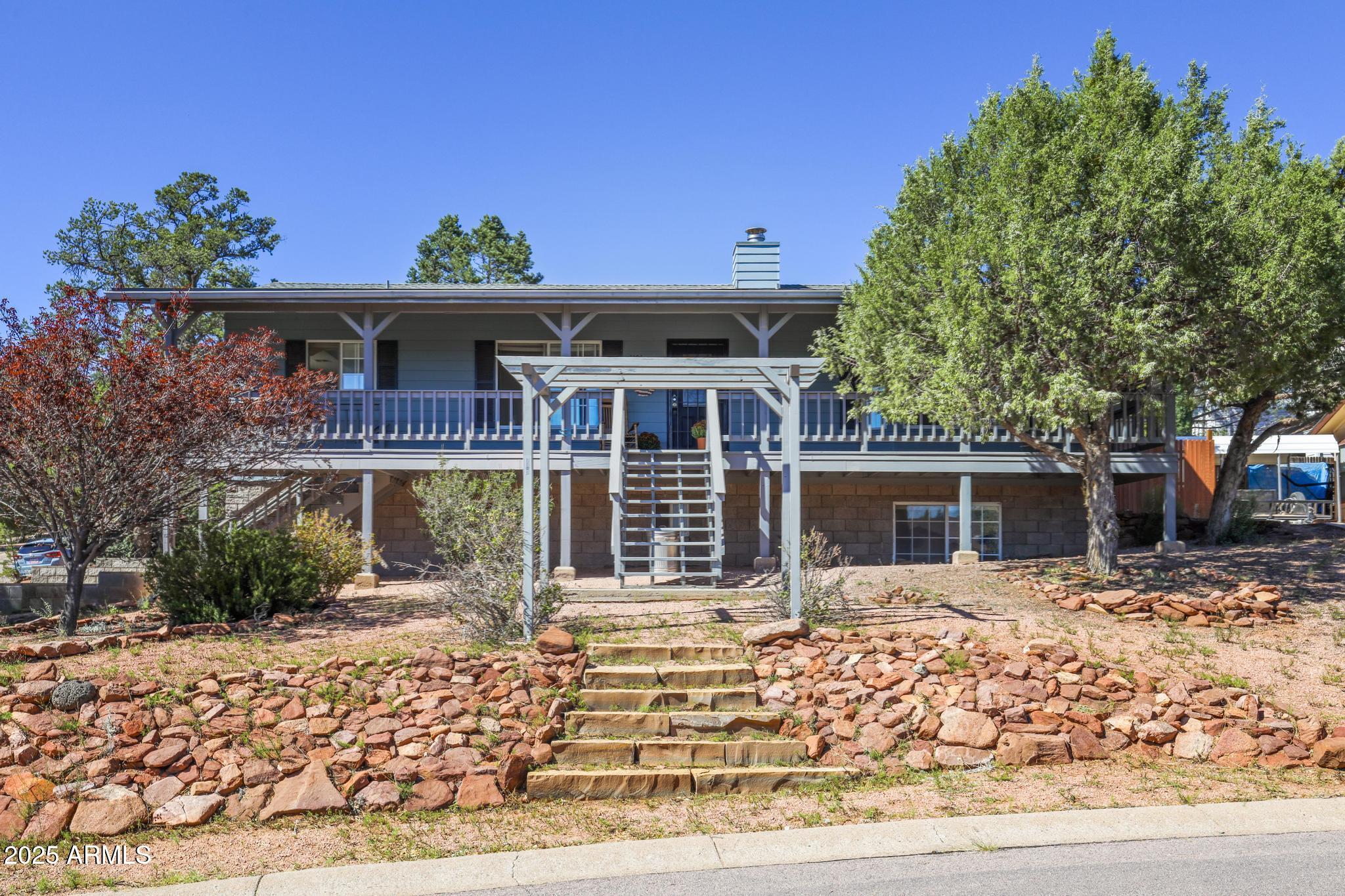 1101 North Monte Rosa Lane Payson, AZ 85541 - Photo 2 of 35 a front view of a house with a porch