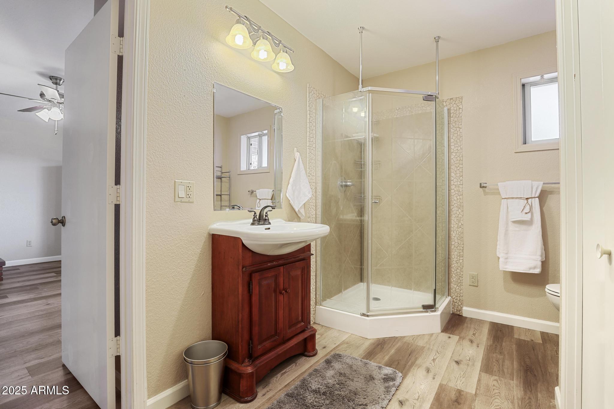 1101 North Monte Rosa Lane Payson, AZ 85541 - Photo 25 of 35 a bathroom with a sink a toilet and shower