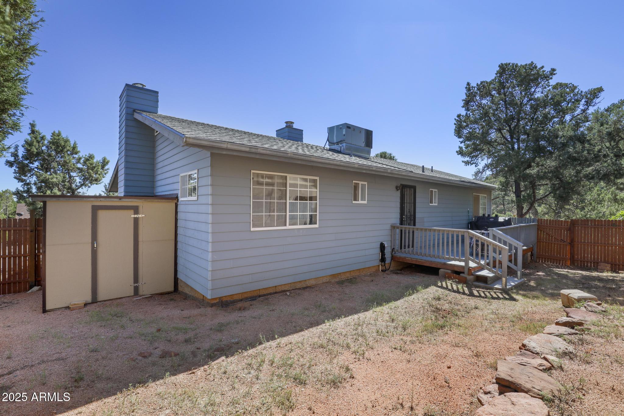1101 North Monte Rosa Lane Payson, AZ 85541 - Photo 31 of 35 a view of a house with a yard and wooden fence
