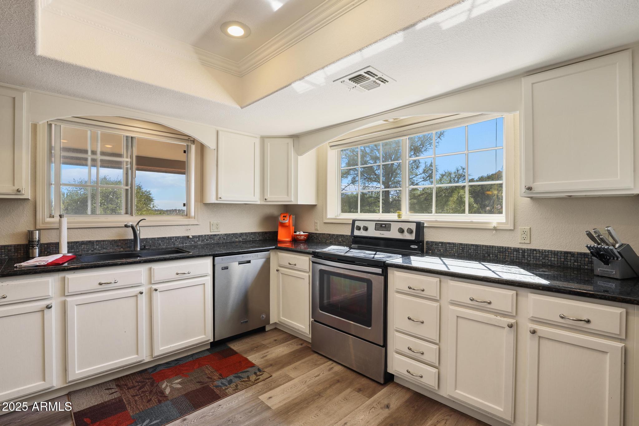 1101 North Monte Rosa Lane Payson, AZ 85541 - Photo 10 of 35 a kitchen with sink stove and cabinets