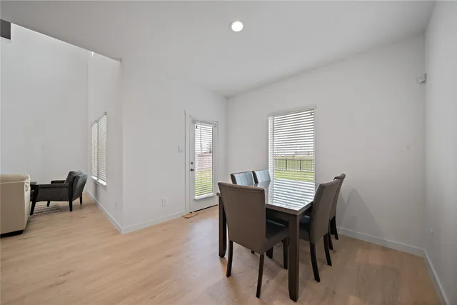 a bathroom with a sink mirror and toilet
