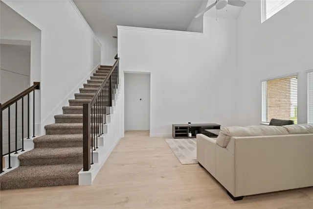 a en suite bathroom with a shower sink and mirror