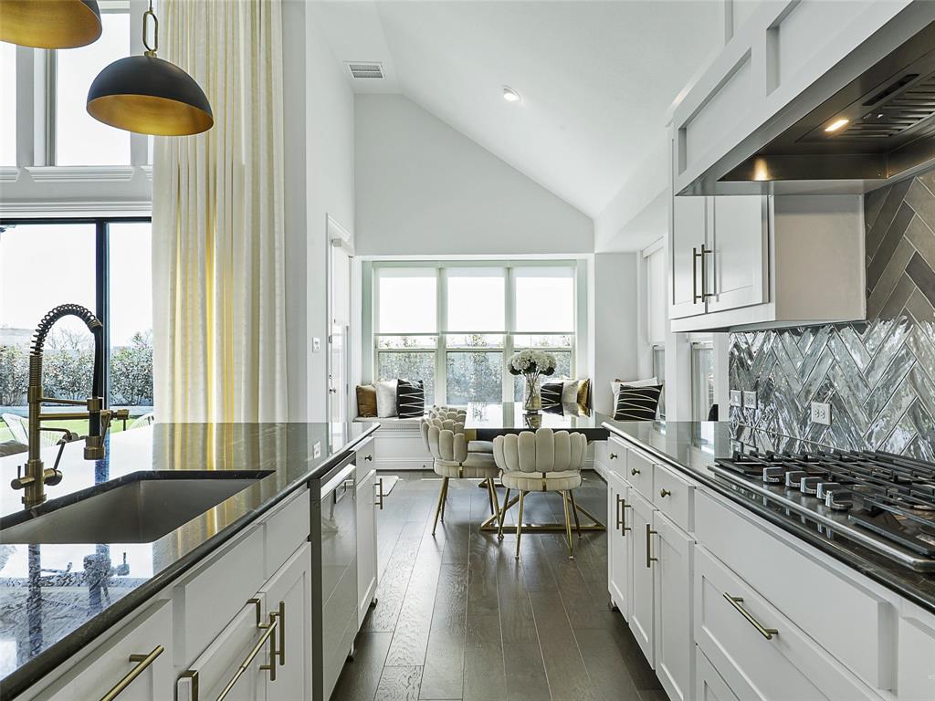 3141 Sunfish Street Prosper, TX 75078 - Photo 33 of 33 a large kitchen with a large window and stainless steel appliances