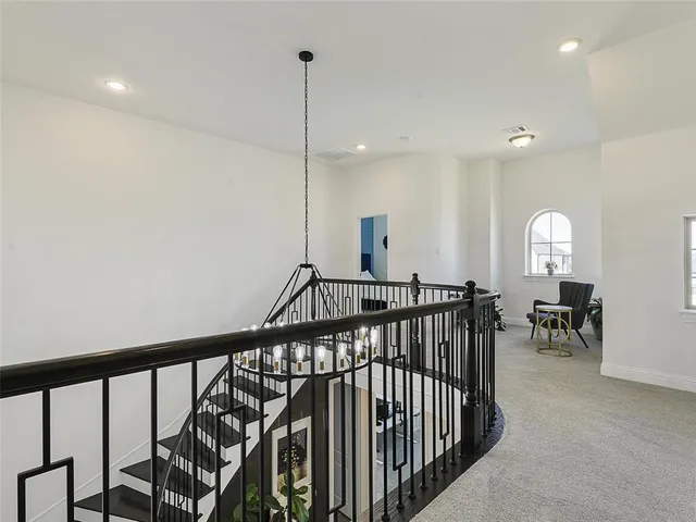 a bathroom with a tub sink shower and a mirror
