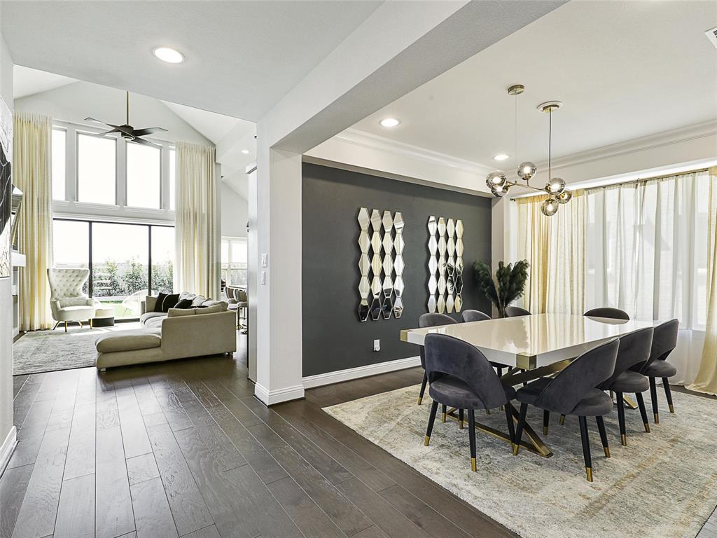3141 Sunfish Street Prosper, TX 75078 - Photo 6 of 33 a view of a dining room with furniture window and wooden floor