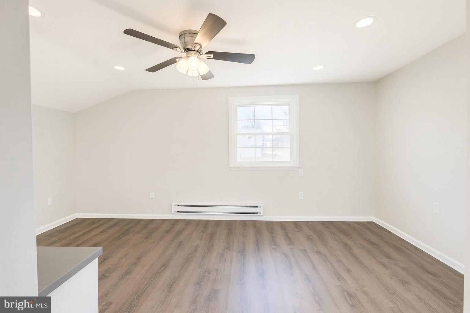 22 Clemson Road Cherry Hill, NJ 08034 - Photo 11 of 25 an empty room with wooden floor and windows