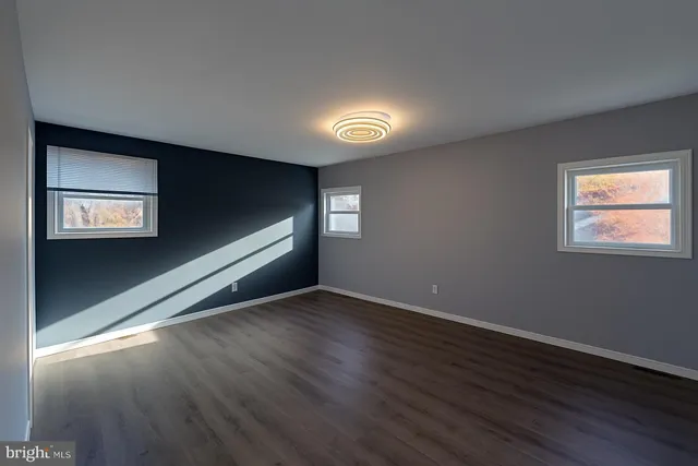 a view of an empty room and window