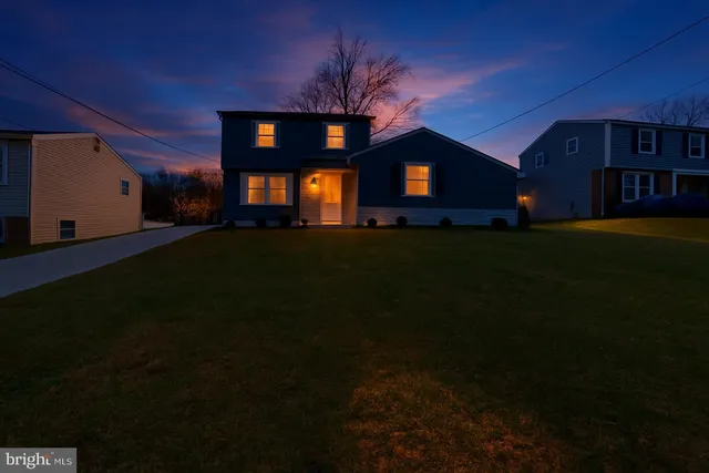 a view of house with outdoor space and garden