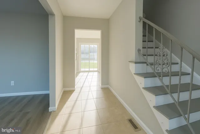 a view of entryway with wooden floor