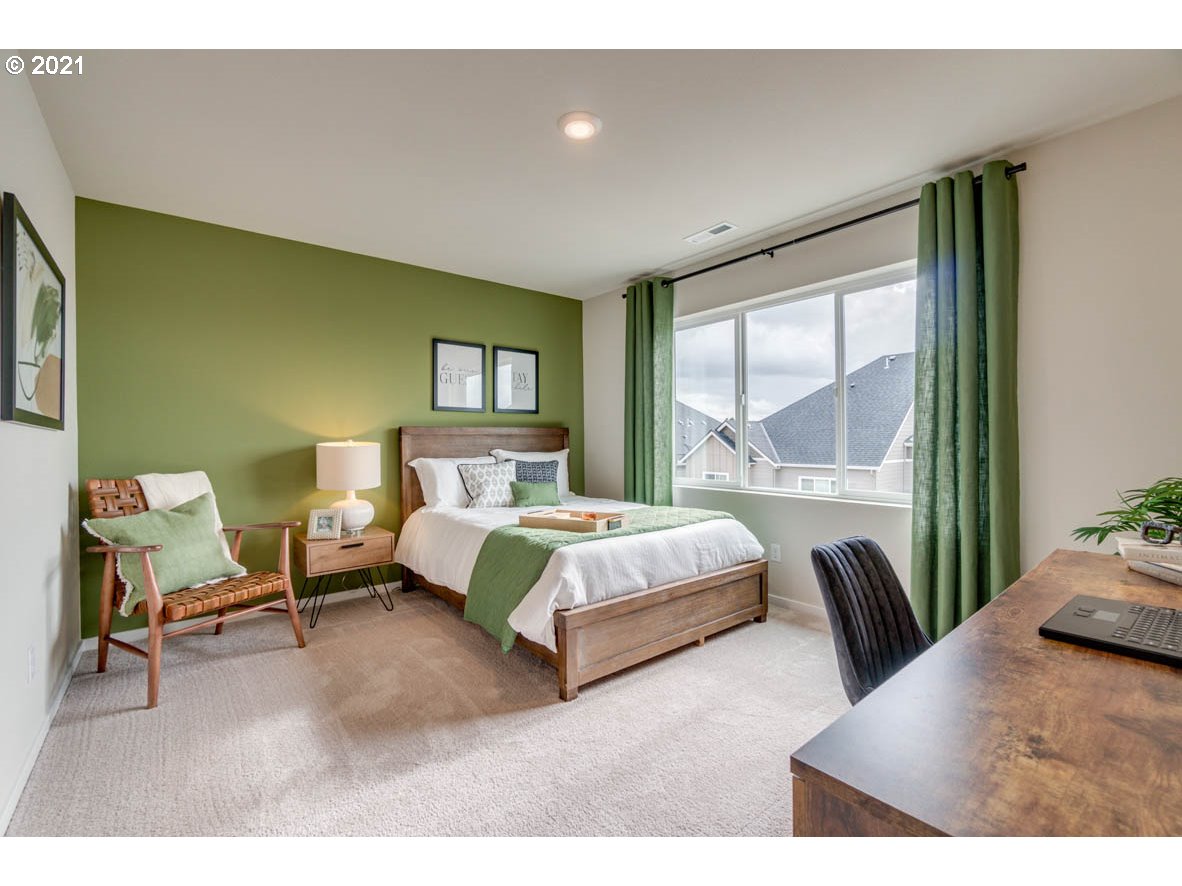 15784 Northwest Brugger Road Portland, OR 97229 - Photo 11 of 21 a bedroom with a bed chair and a large window