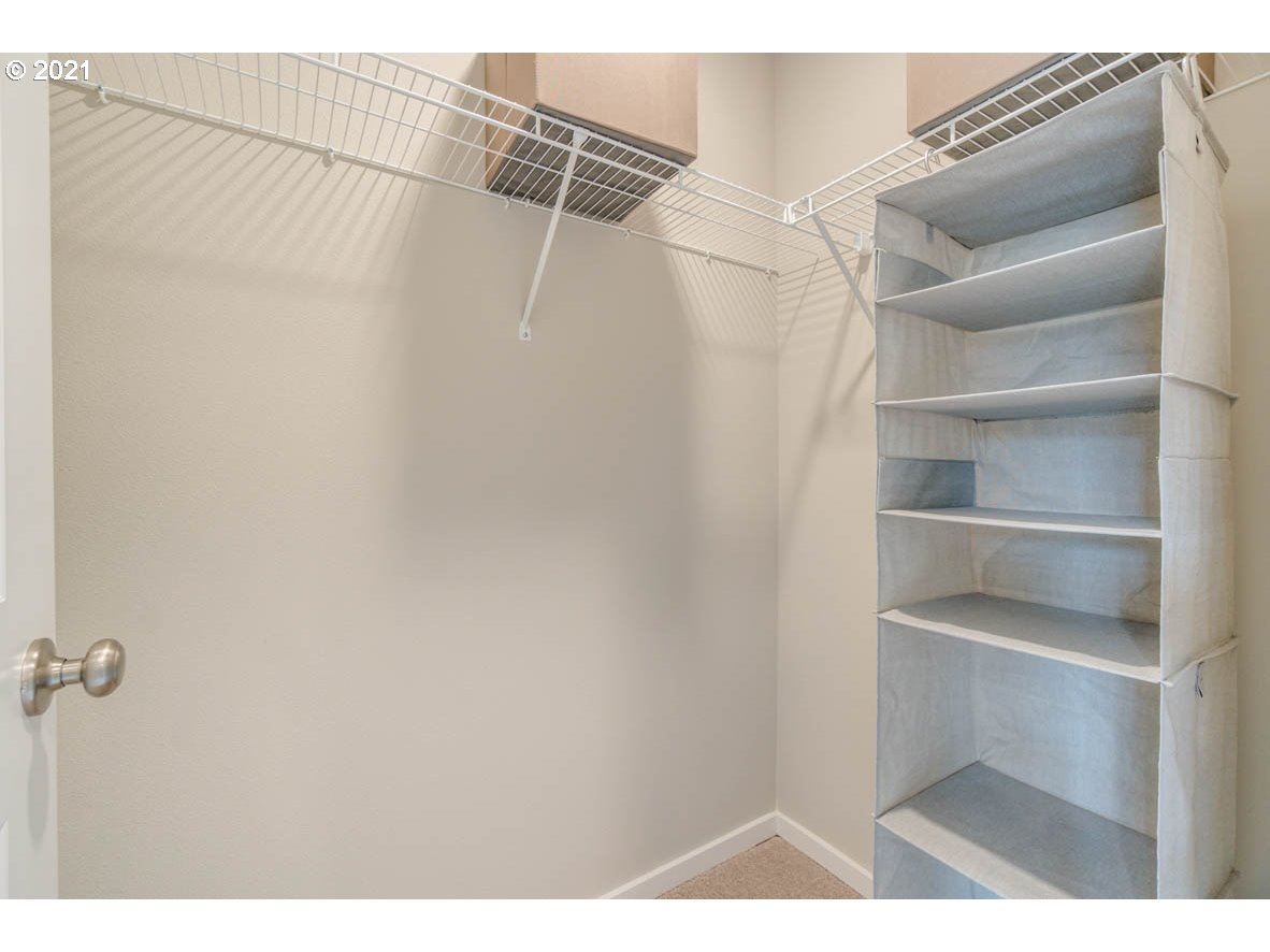 15784 Northwest Brugger Road Portland, OR 97229 - Photo 12 of 21 a view of walk in closet with empty racks