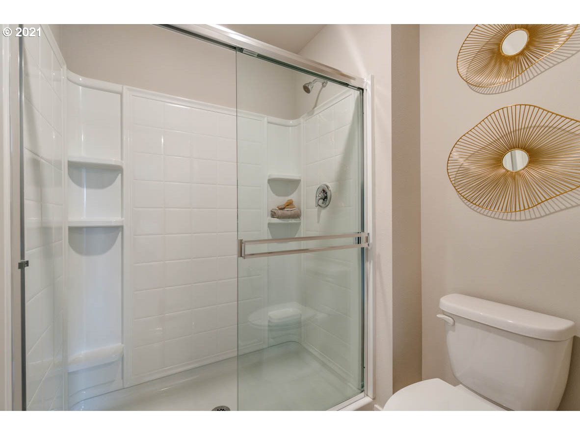 15784 Northwest Brugger Road Portland, OR 97229 - Photo 18 of 21 a bathroom with a shower a toilet and a sink