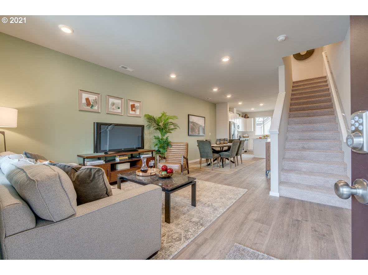 15784 Northwest Brugger Road Portland, OR 97229 - Photo 2 of 21 a living room with furniture and a flat screen tv