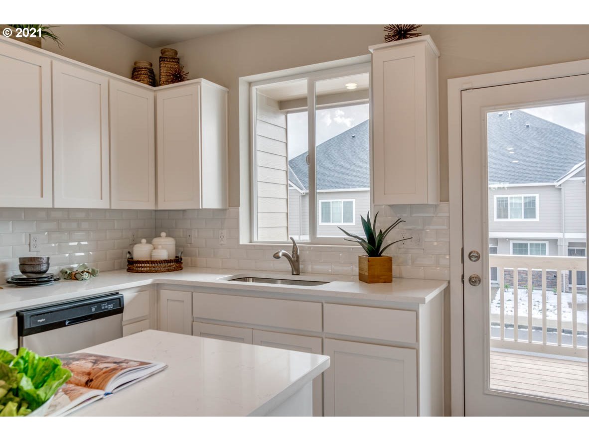 15784 Northwest Brugger Road Portland, OR 97229 - Photo 7 of 21 a kitchen with a sink and cabinets