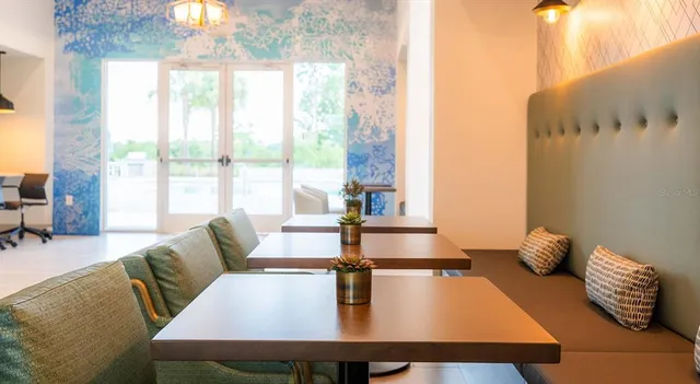 a lobby with furniture and window