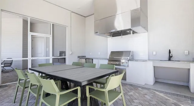 a view of living room filled with furniture and windows