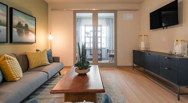 a living room with furniture and a window