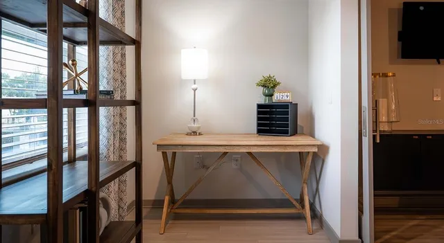a kitchen that has a dining table and appliances
