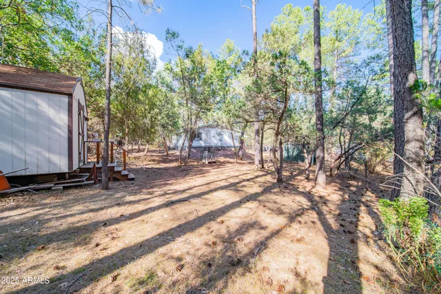 a view of a backyard of the house
