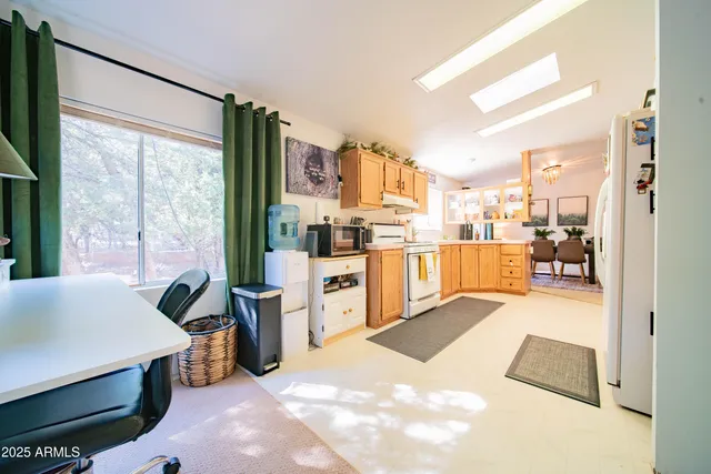 a view of kitchen with furniture and large window