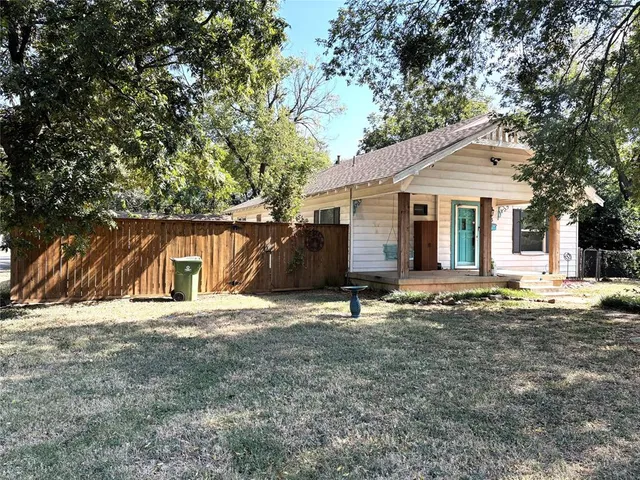 a house with trees in the background