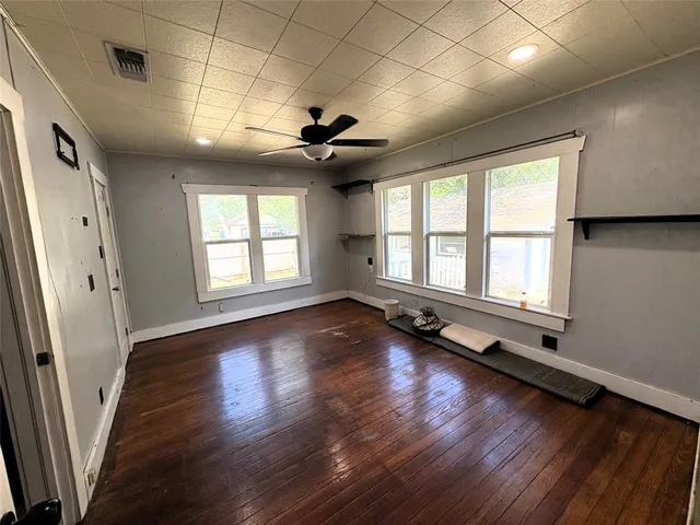 a view of kitchen with cabinets and wooden floor
