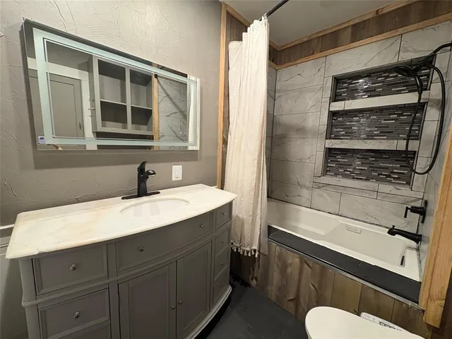 a view of a livingroom with wooden floor