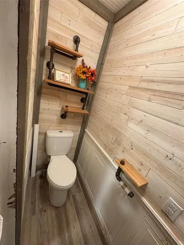 a room with wooden floor and window