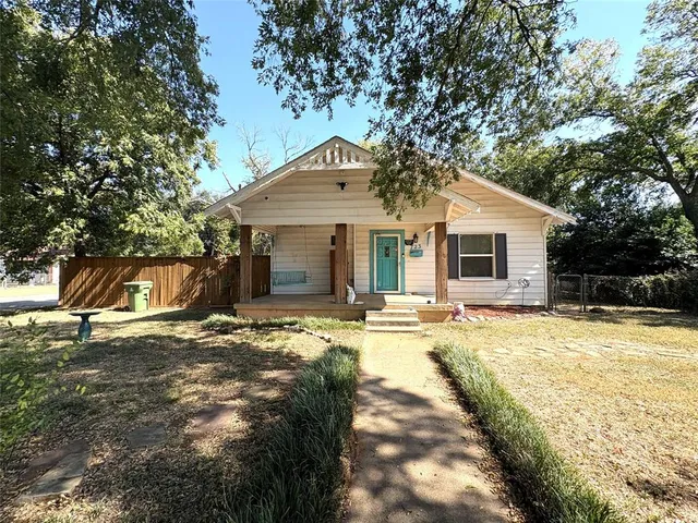 a view of a house with snow on the background