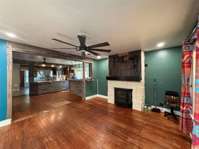 a view of a backyard with a tree