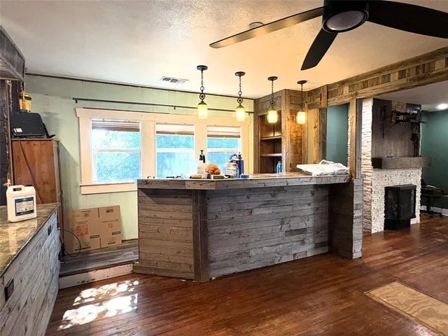 a view of a room with furniture and a window