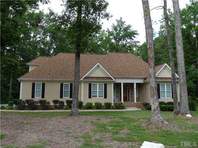 220 Weaver Ridge Road Rougemont, NC 27572 - Photo 1 of 12 a house that has a tree in front of the house