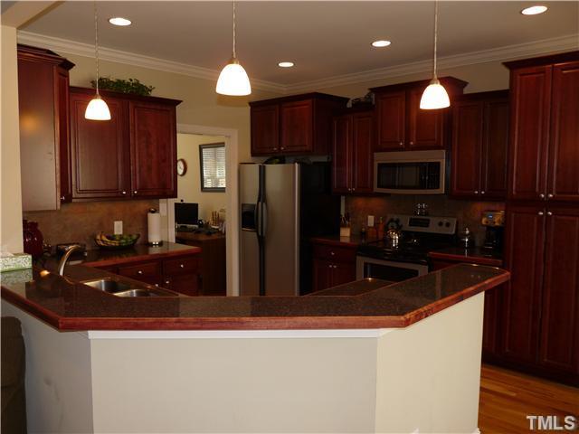 220 Weaver Ridge Road Rougemont, NC 27572 - Photo 5 of 12 a kitchen with refrigerator a sink and a stove