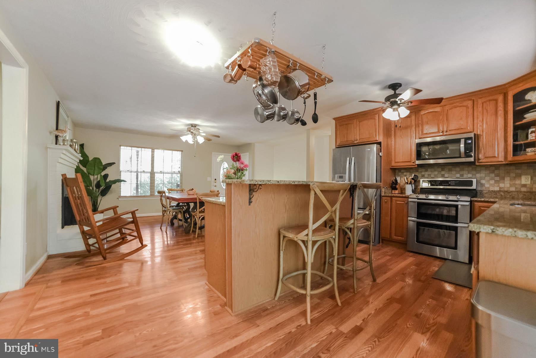 25855 Ricky Drive Hollywood, MD 20636 - Photo 21 of 49 Pot rack above island conveys
