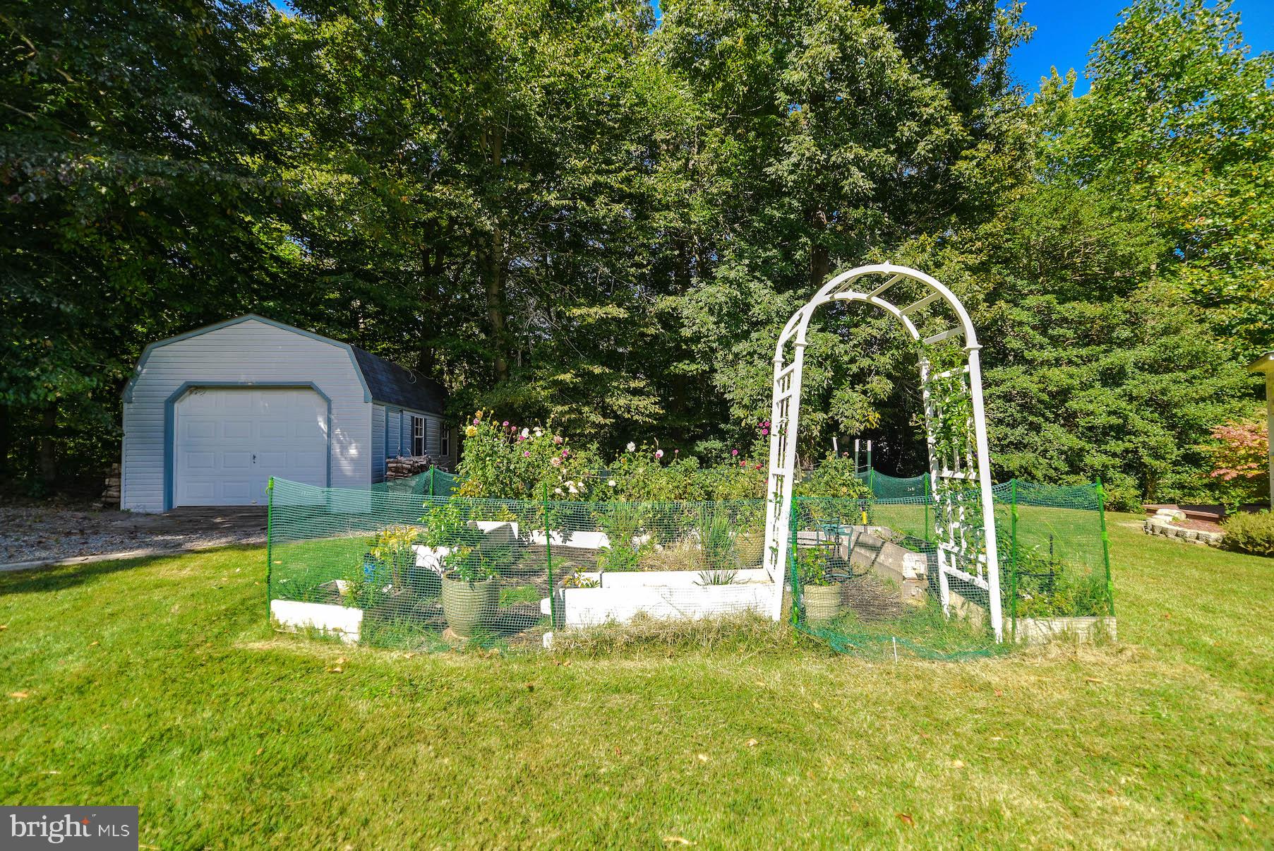 25855 Ricky Drive Hollywood, MD 20636 - Photo 46 of 49 Established flower/veggie garden