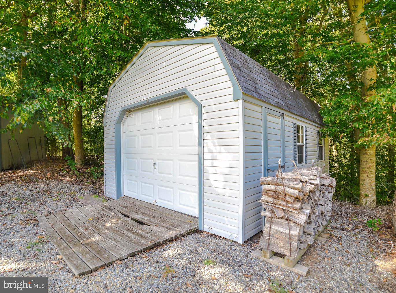 25855 Ricky Drive Hollywood, MD 20636 - Photo 48 of 49 Newer shed keeps garage clutter-free!