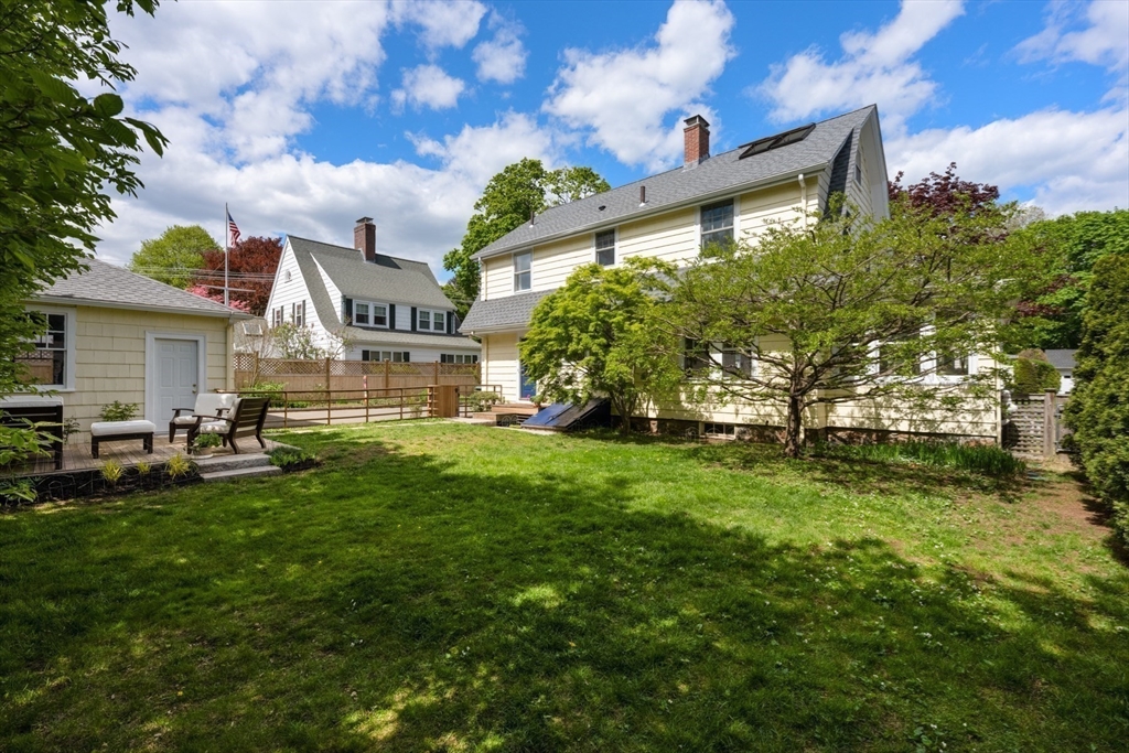 8 Charlotte Road Marblehead, MA 01945 - Photo 29 of 37 a front view of a house with a garden and trees