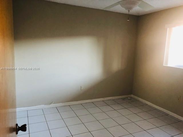 2212 West 74th Street, Unit 10128 Hialeah, FL 33016 - Photo 11 of 12 an empty room and window