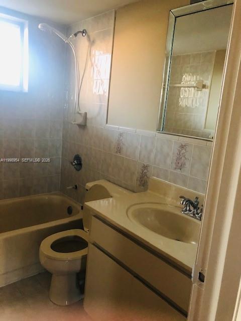 2212 West 74th Street, Unit 10128 Hialeah, FL 33016 - Photo 12 of 12 a bathroom with a sink a toilet and shower