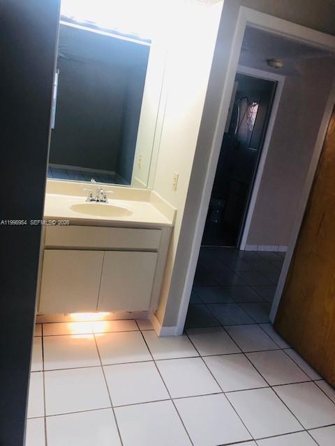 2212 West 74th Street, Unit 10128 Hialeah, FL 33016 - Photo 9 of 12 a bathroom with a sink and mirror