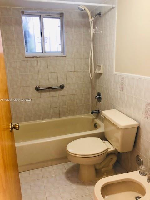 2212 West 74th Street, Unit 10128 Hialeah, FL 33016 - Photo 10 of 12 a white toilet and tub next to a bathroom sink