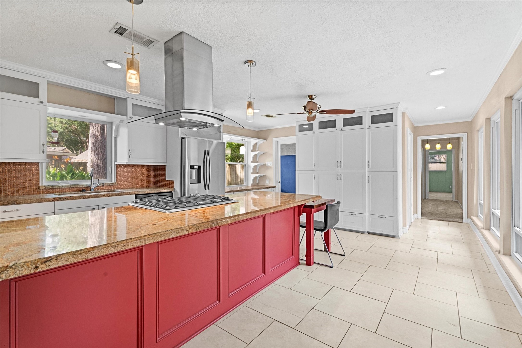 25319 Old Carriage Lane Spring, TX 77373 - Photo 6 of 35 a large kitchen with granite countertop a sink and cabinets