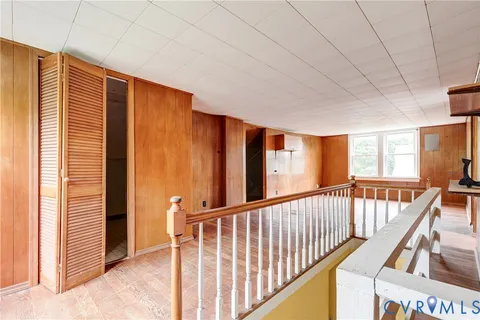 a view of a hallway with windows
