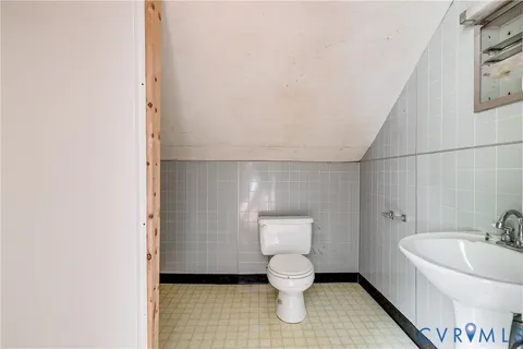 a bathroom with a toilet and a sink