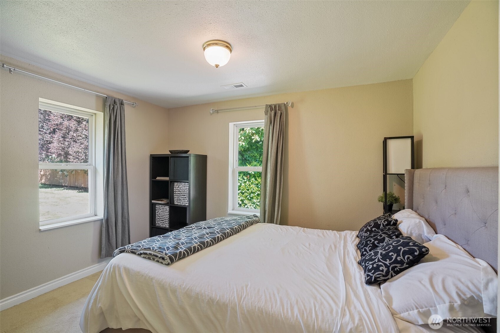 9810 Northeast 3rd Street Vancouver, WA 98664 - Photo 29 of 40 a bedroom with a bed and a window