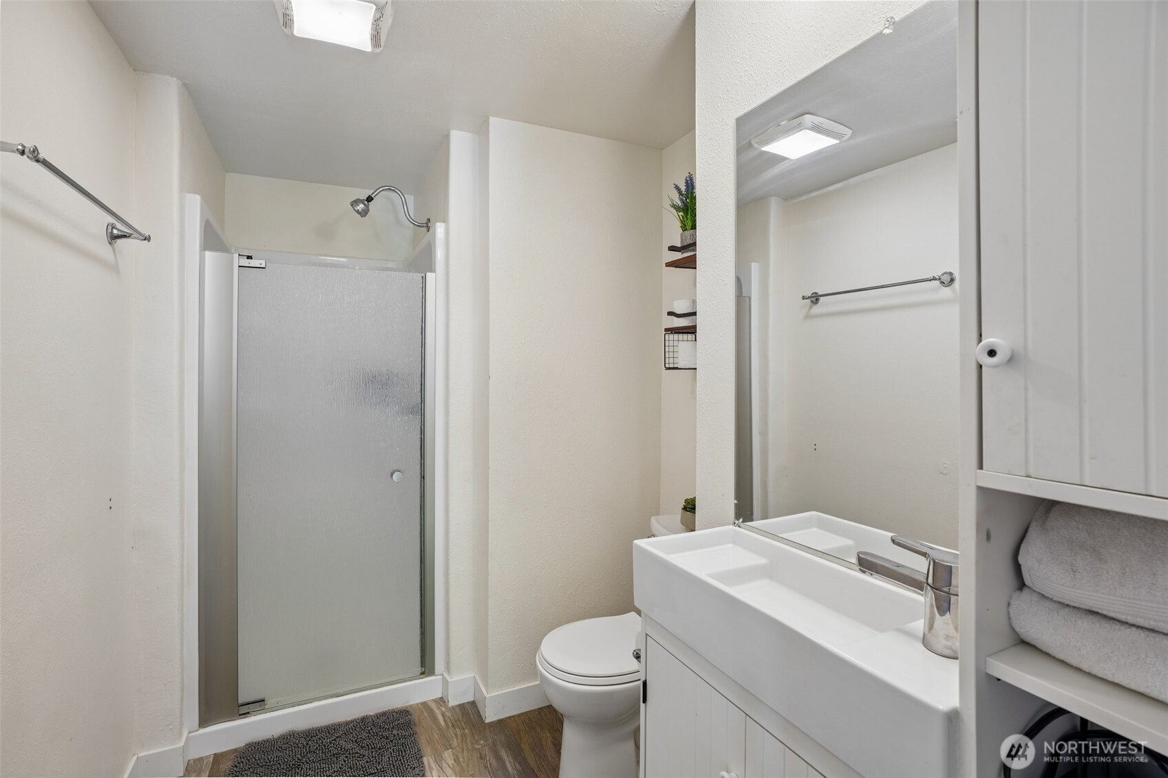 9810 Northeast 3rd Street Vancouver, WA 98664 - Photo 37 of 40 a bathroom with a granite countertop sink toilet a mirror and shower