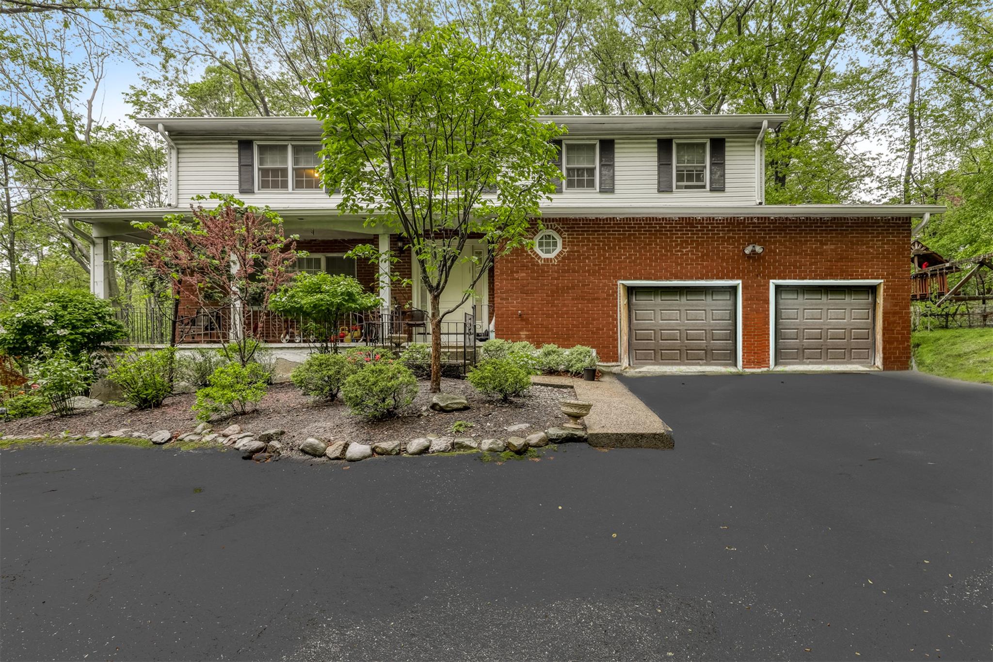 front view of a house with a street