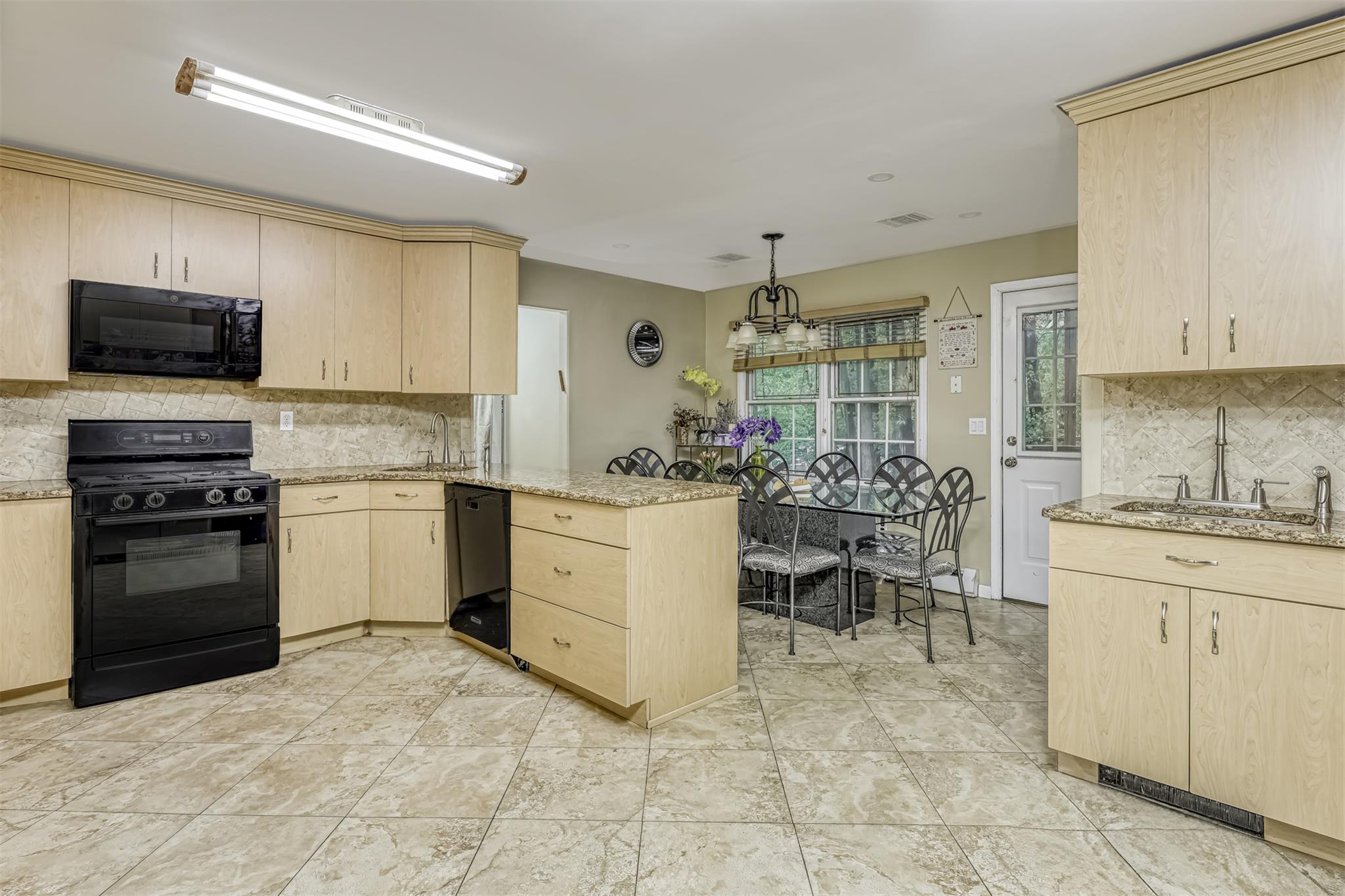 60 Highview Road Monsey, NY 10952 - Photo 11 of 26 a kitchen with cabinets and chairs
