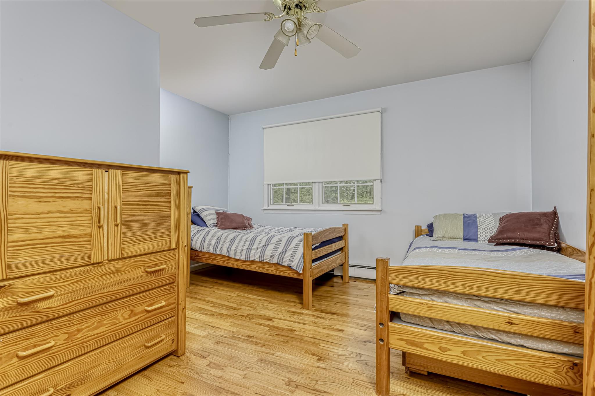 60 Highview Road Monsey, NY 10952 - Photo 21 of 26 a bedroom with a bed and a chandelier