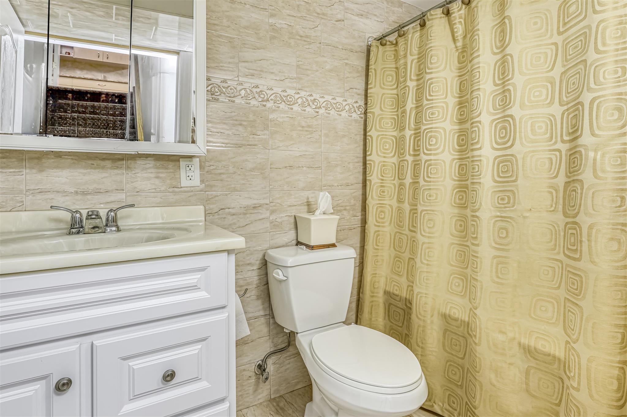 60 Highview Road Monsey, NY 10952 - Photo 26 of 26 a bathroom with a toilet a sink and a shower